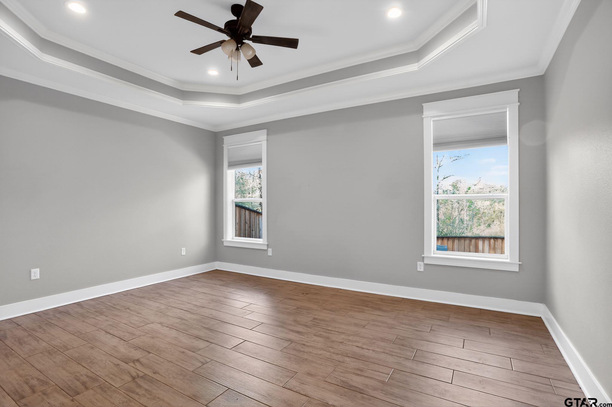7600 County Road 210 Tyler, TX 75702 - Photo 19 of 30 a view of an empty room with wooden floor and a window