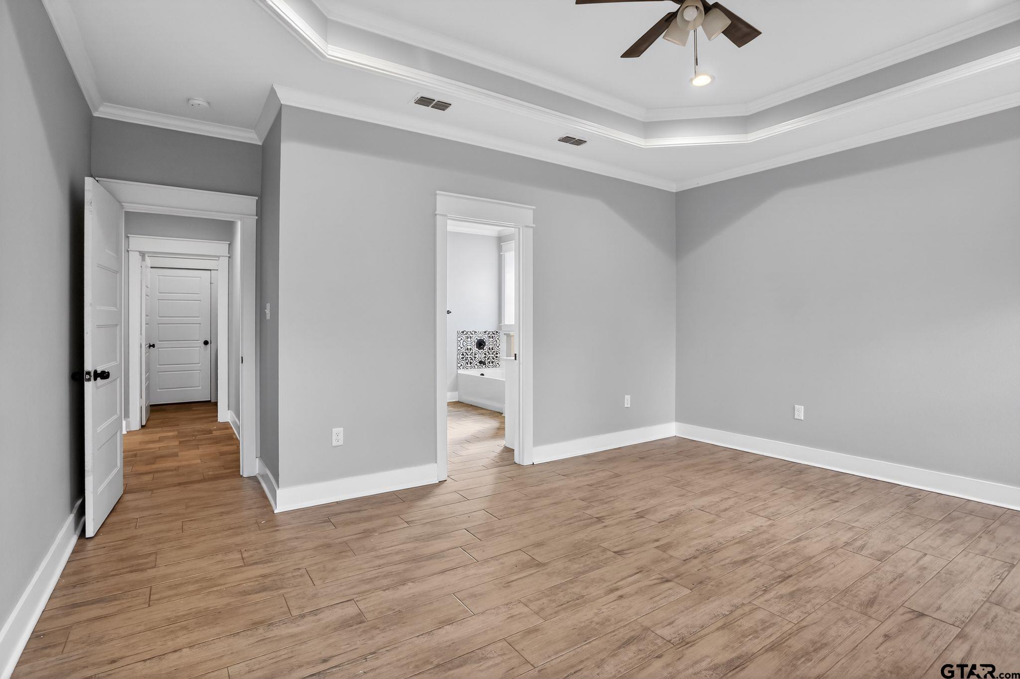 7600 County Road 210 Tyler, TX 75702 - Photo 20 of 30 wooden floor in a hall with an empty space
