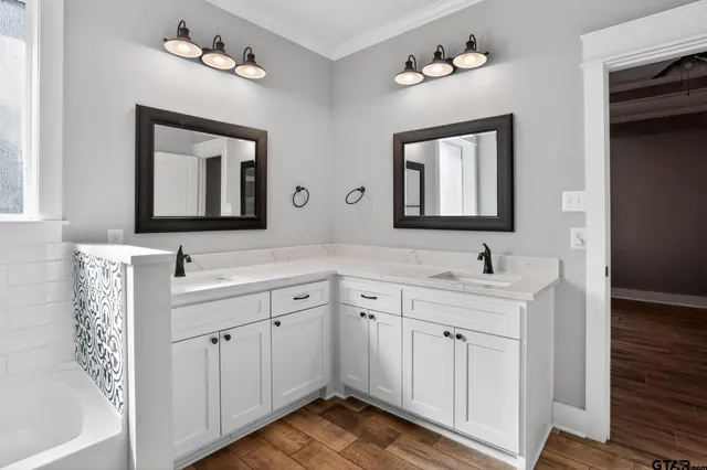 a bathroom with a bathtub and a shower