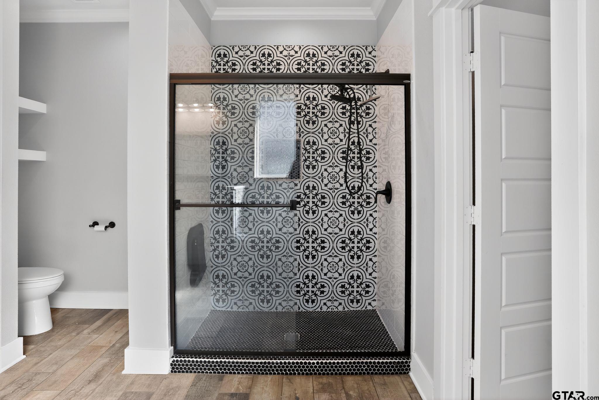 7600 County Road 210 Tyler, TX 75702 - Photo 25 of 30 a bathroom with a granite countertop shower a toilet and a sink