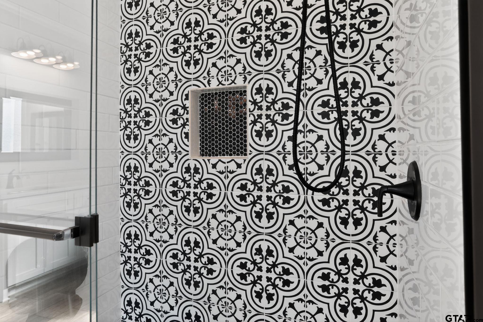 7600 County Road 210 Tyler, TX 75702 - Photo 26 of 30 a wall with paintings on the wall and a shower