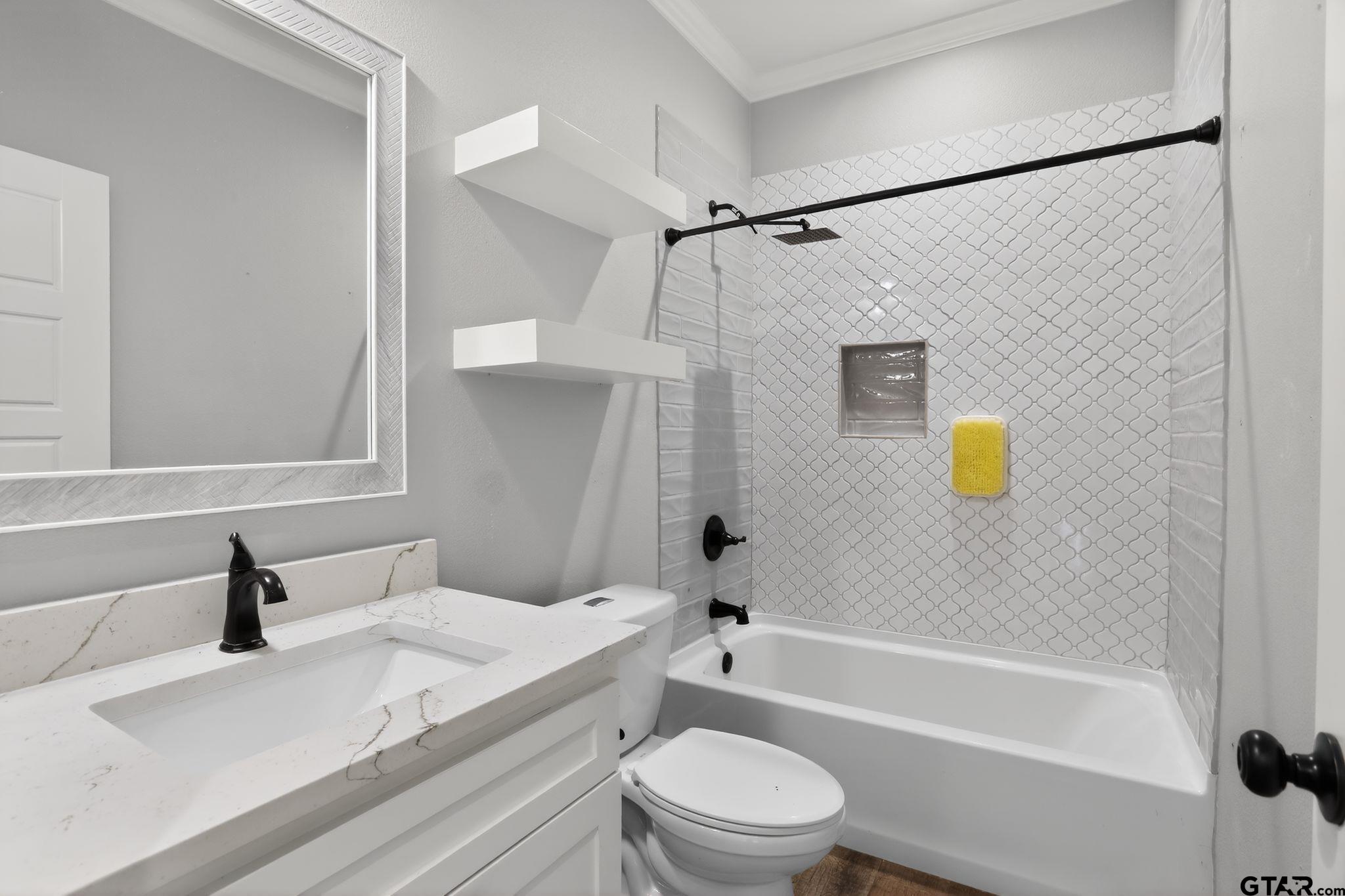 7600 County Road 210 Tyler, TX 75702 - Photo 27 of 30 a bathroom with a sink toilet and bathtub