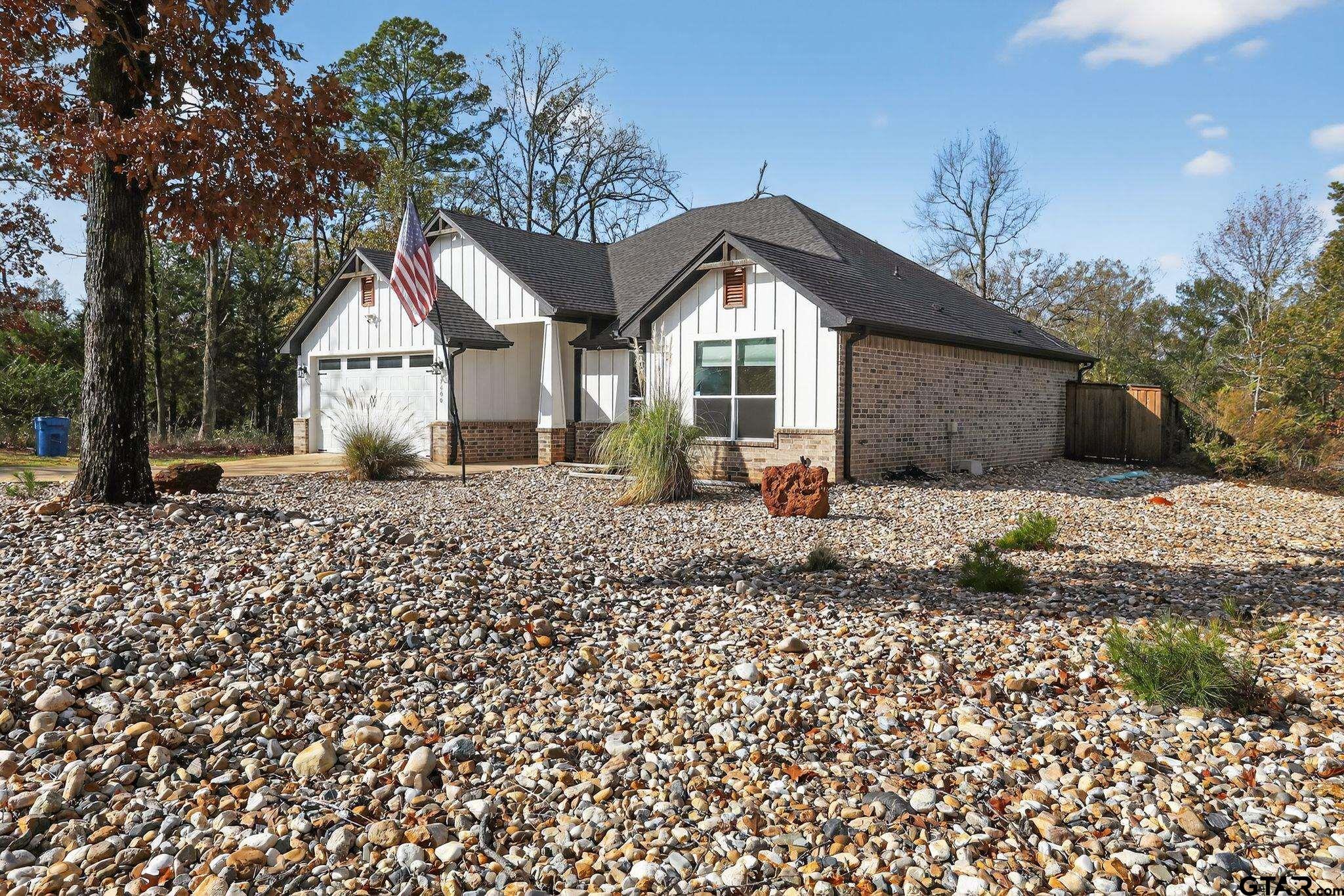 7600 County Road 210 Tyler, TX 75702 - Photo 3 of 30 a front view of a house with a yard