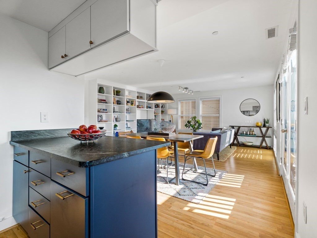 2 Boylston Street, Unit 4 Boston, MA 02130 - Photo 11 of 30 a view of a dining room with furniture and wooden floor