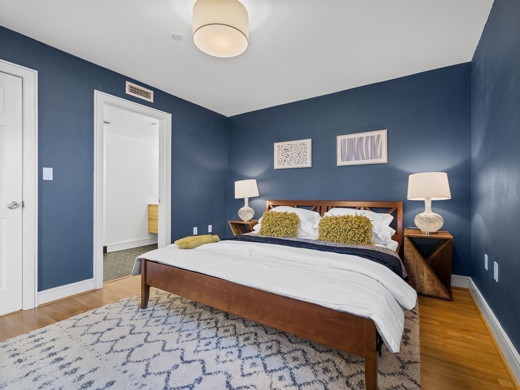 2 Boylston Street, Unit 4 Boston, MA 02130 - Photo 14 of 30 a bedroom with a bed and a lamp