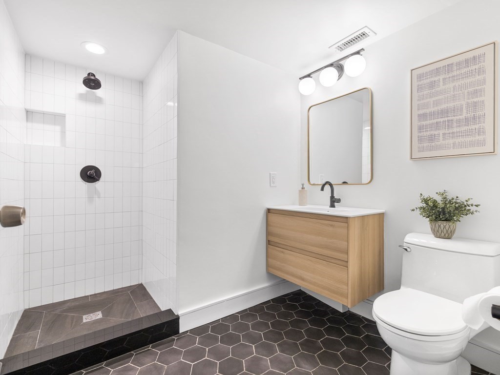 2 Boylston Street, Unit 4 Boston, MA 02130 - Photo 15 of 30 a bathroom with a sink toilet and shower