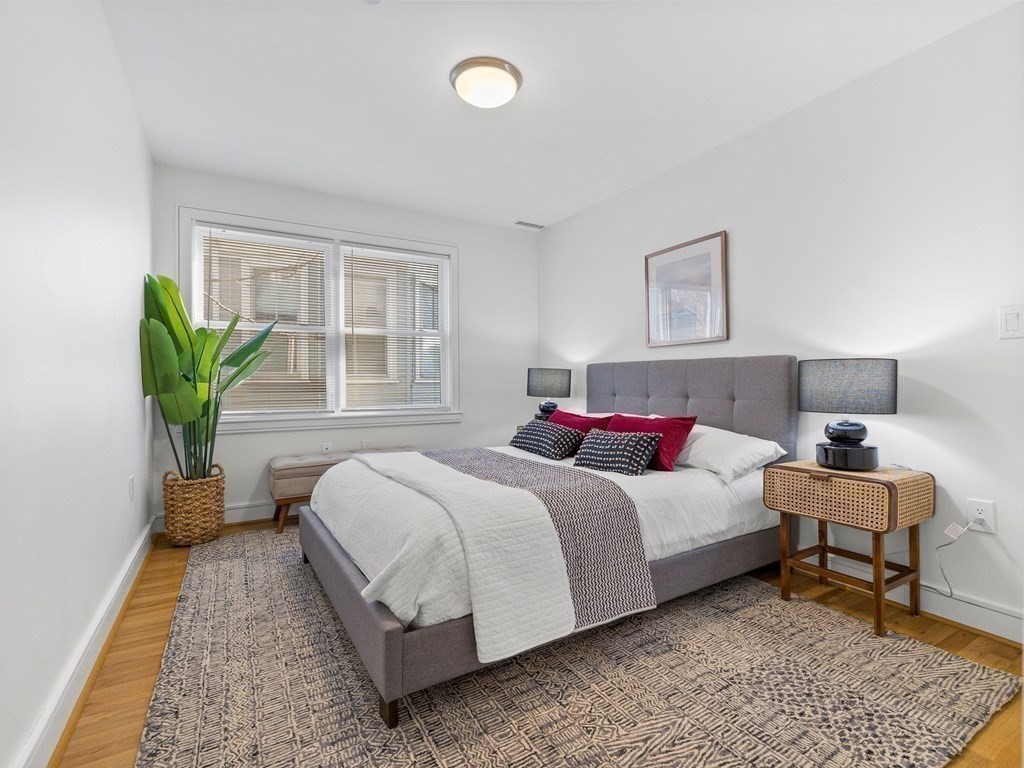 2 Boylston Street, Unit 4 Boston, MA 02130 - Photo 17 of 30 a bedroom with a bed and a potted plant