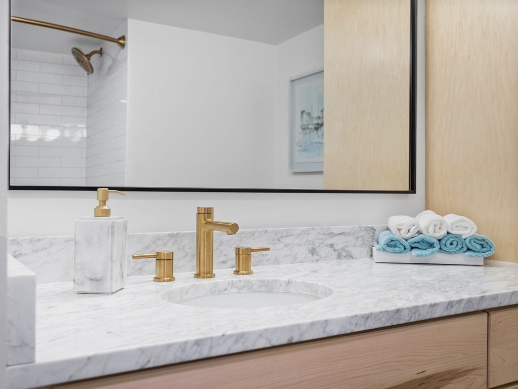 2 Boylston Street, Unit 4 Boston, MA 02130 - Photo 19 of 30 a bathroom with a sink and a mirror