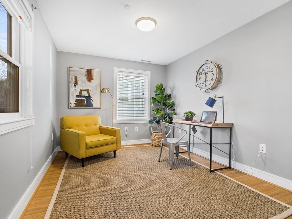 2 Boylston Street, Unit 4 Boston, MA 02130 - Photo 20 of 30 a living room with furniture and a window