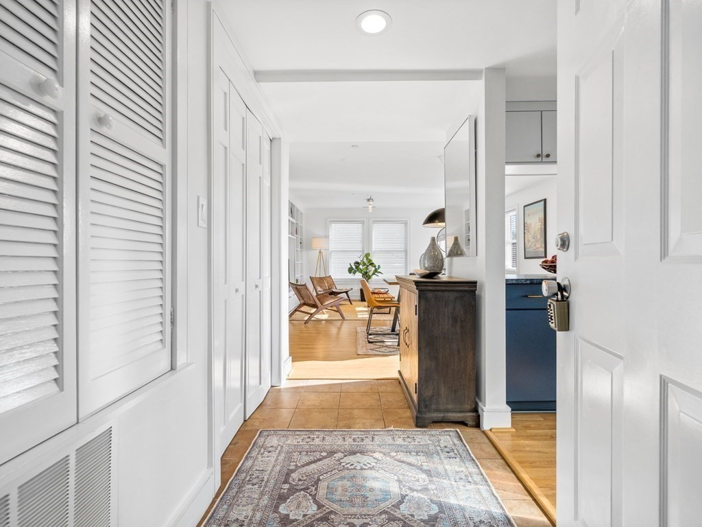 2 Boylston Street, Unit 4 Boston, MA 02130 - Photo 2 of 30 a view of a living room with a fireplace