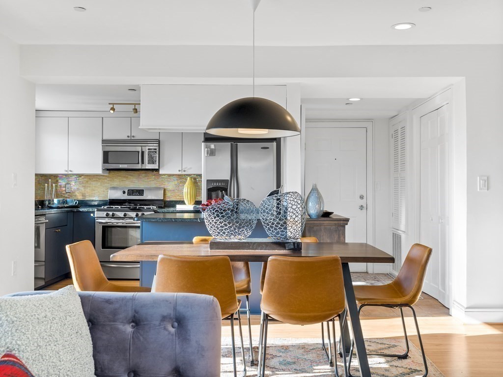 2 Boylston Street, Unit 4 Boston, MA 02130 - Photo 6 of 30 a view of a dining room with furniture and wooden floor