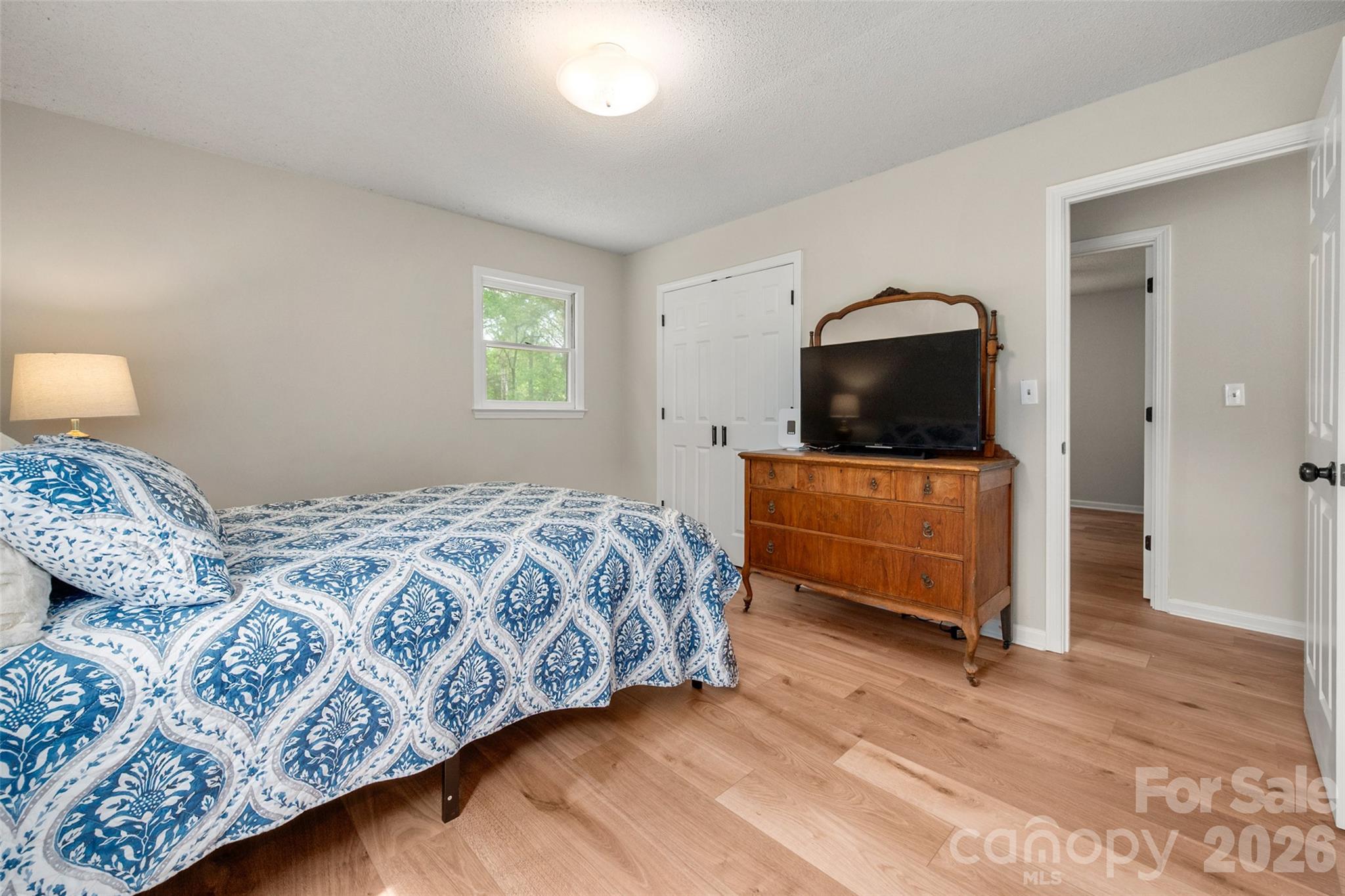 5219 New Town Road Waxhaw, NC 28173 - Photo 21 of 35 a bedroom with a bed and a view of living room