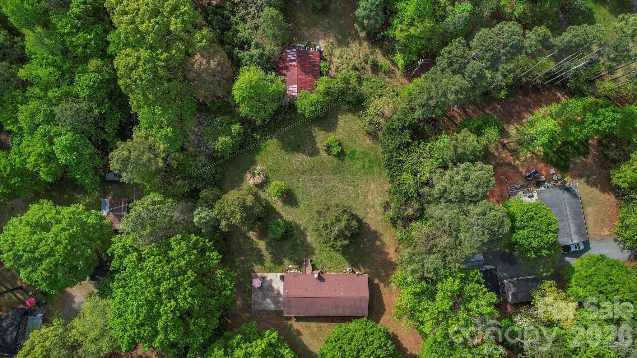 5219 New Town Road Waxhaw, NC 28173 - Photo 32 of 35 an aerial view of a house with a yard and tree s