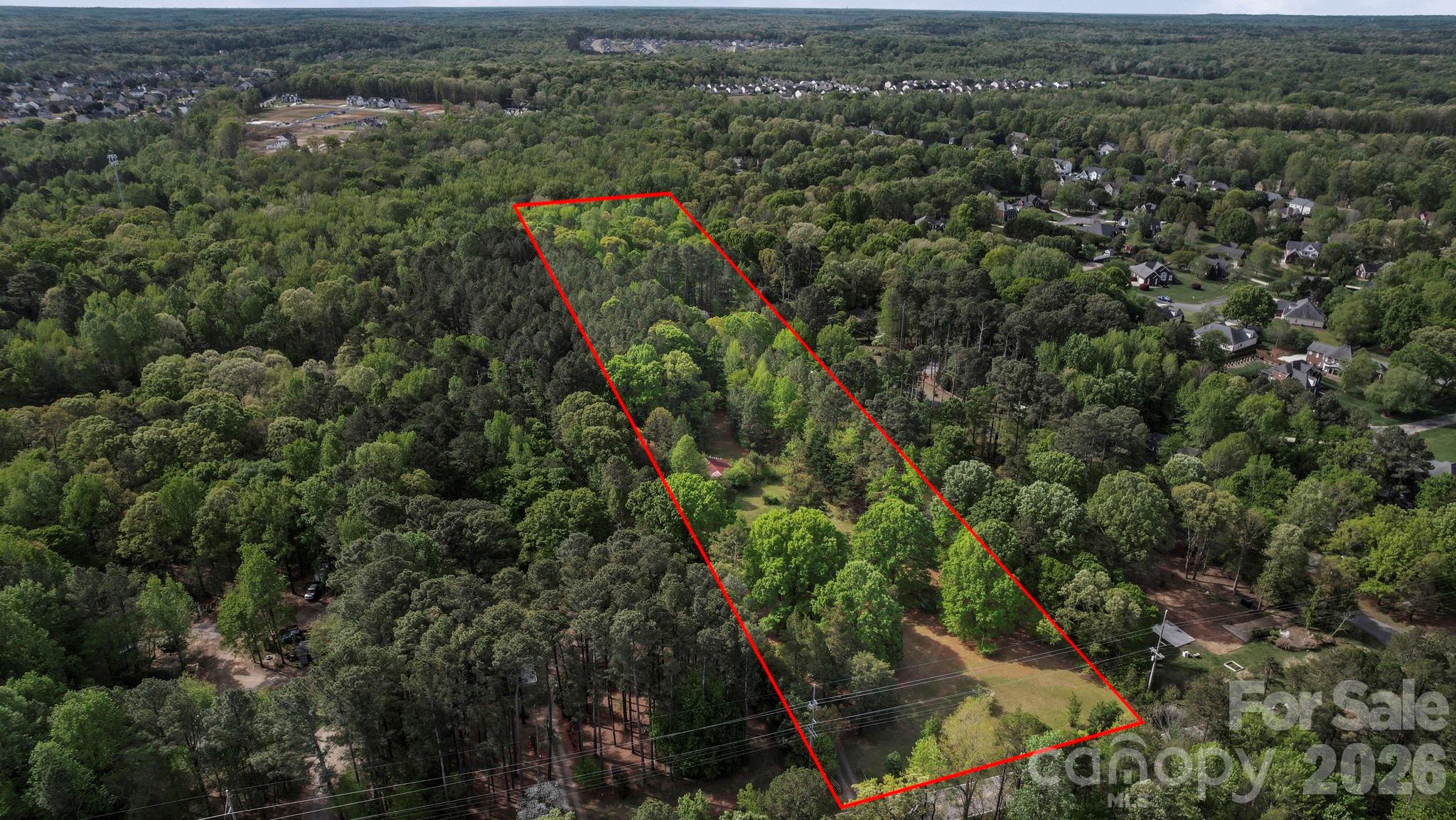 5219 New Town Road Waxhaw, NC 28173 - Photo 34 of 35 an aerial view of residential house with outdoor space and trees