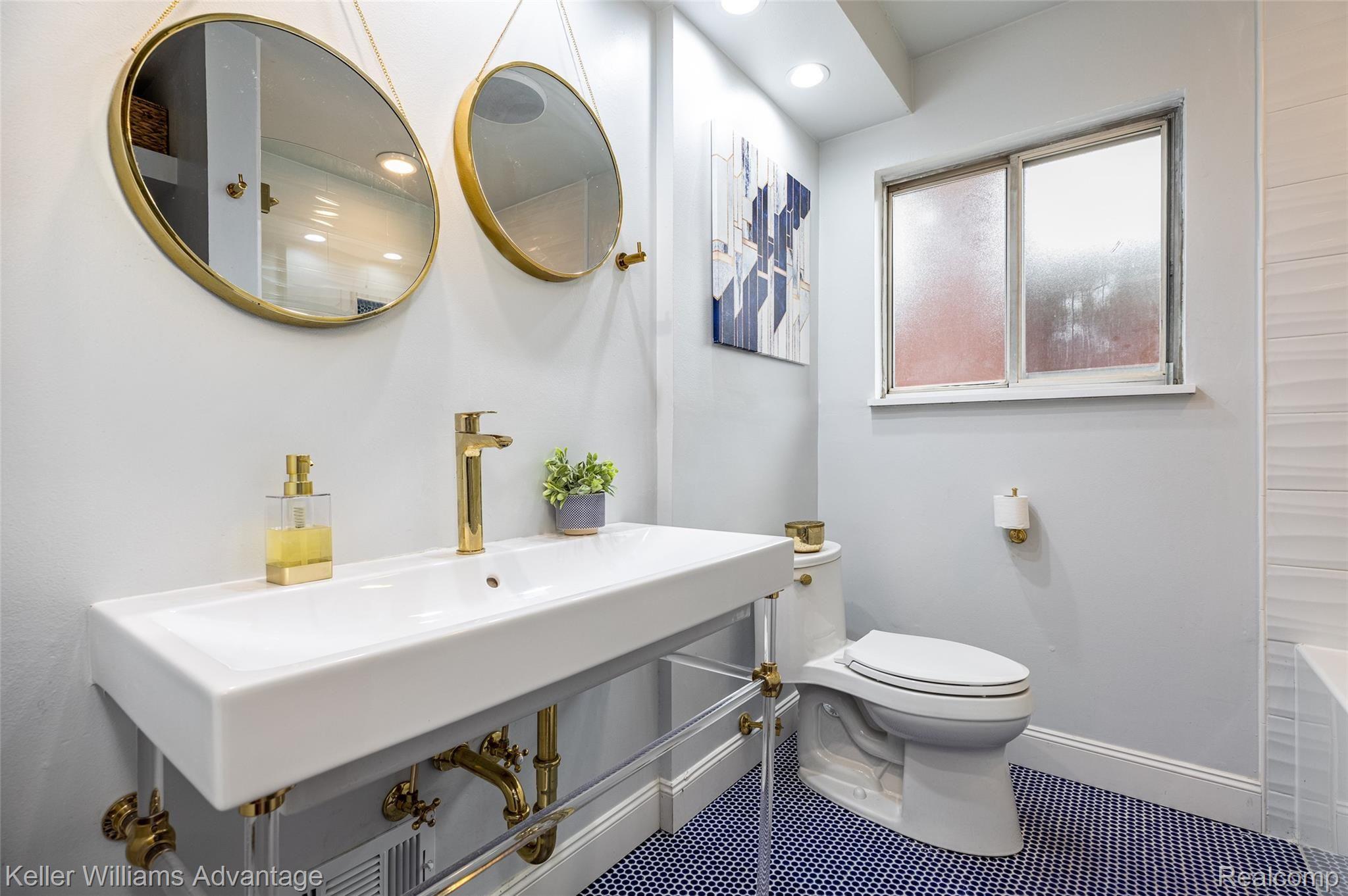19085 Mott Avenue Eastpointe, MI 48021 - Photo 18 of 26 Beautifully updated main bathroom (2020) with Gold finishes and blue Mosaic tile