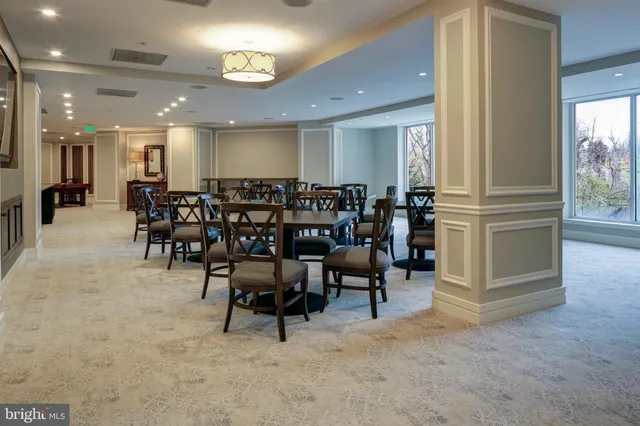 a view of a big dining room with furniture window and outside view