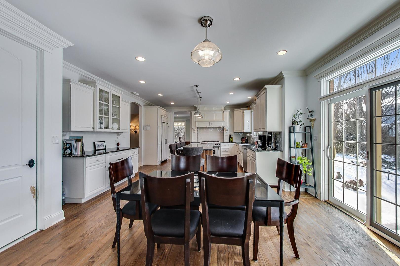 819 Redbud Lane Wilmette, IL 60091 - Photo 18 of 70 a view of a dining room with furniture window and wooden floor