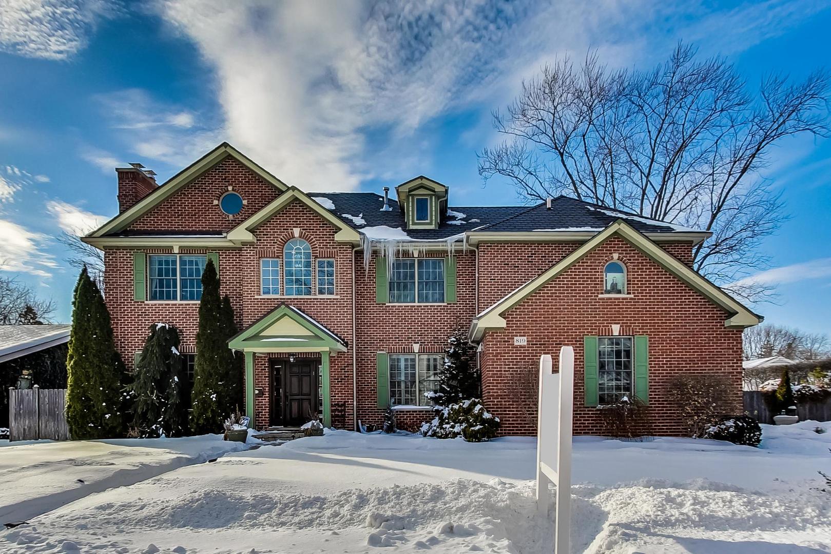 819 Redbud Lane Wilmette, IL 60091 - Photo 2 of 70 a front view of a house with a yard