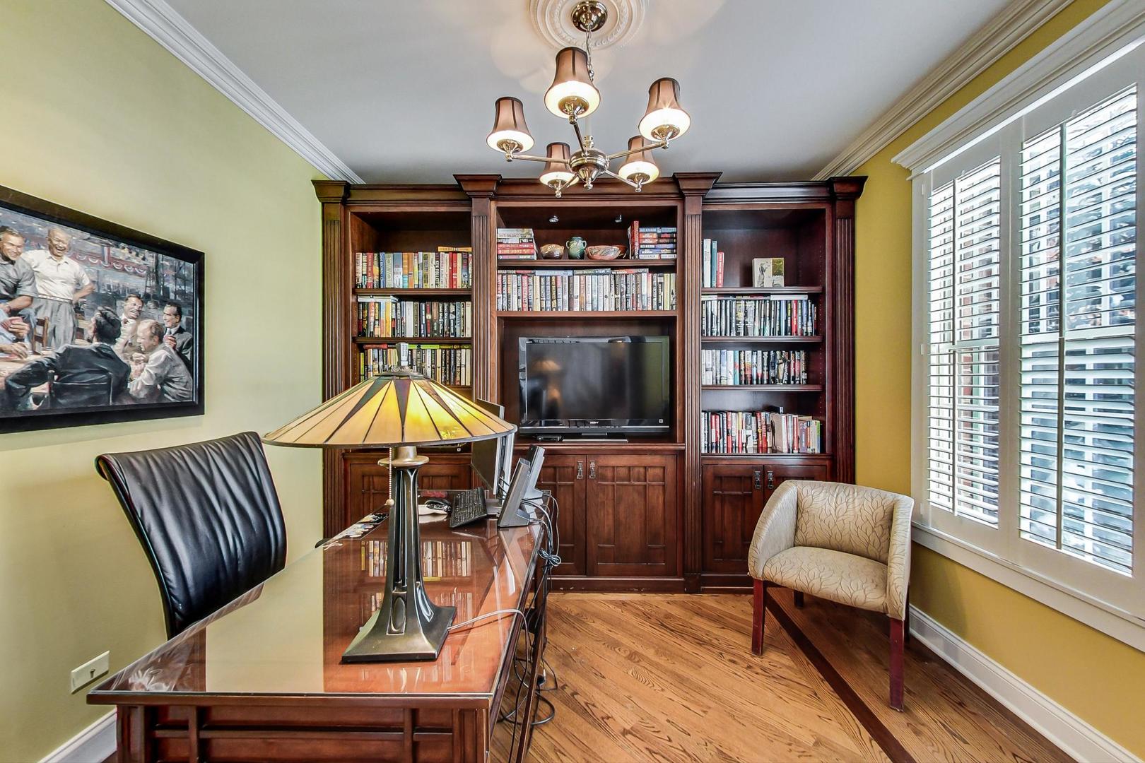 819 Redbud Lane Wilmette, IL 60091 - Photo 22 of 70 a living room with furniture a rug and a chandelier