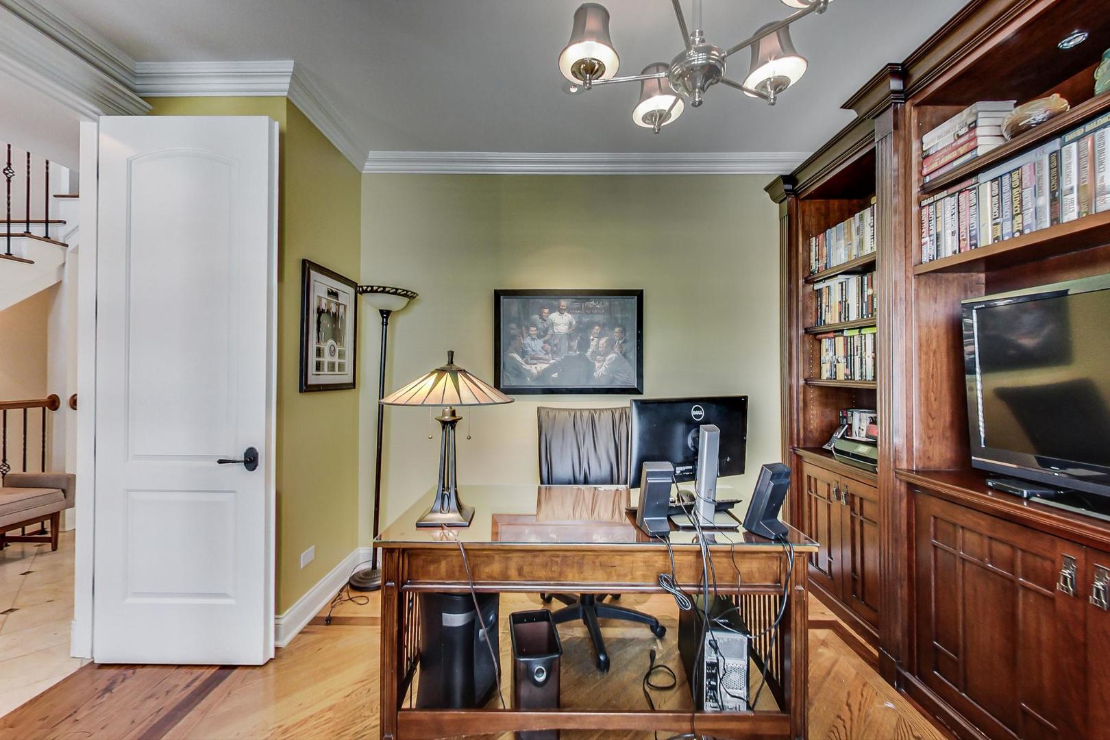 819 Redbud Lane Wilmette, IL 60091 - Photo 23 of 70 a view of a dining room with furniture a rug and wooden floor
