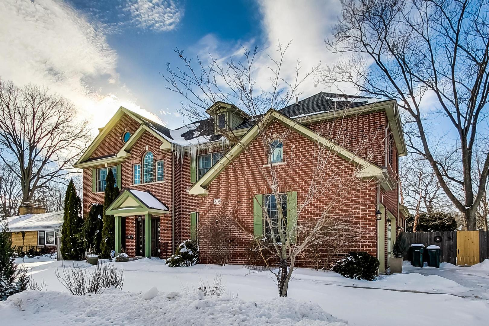819 Redbud Lane Wilmette, IL 60091 - Photo 3 of 70 a front view of a house with a yard