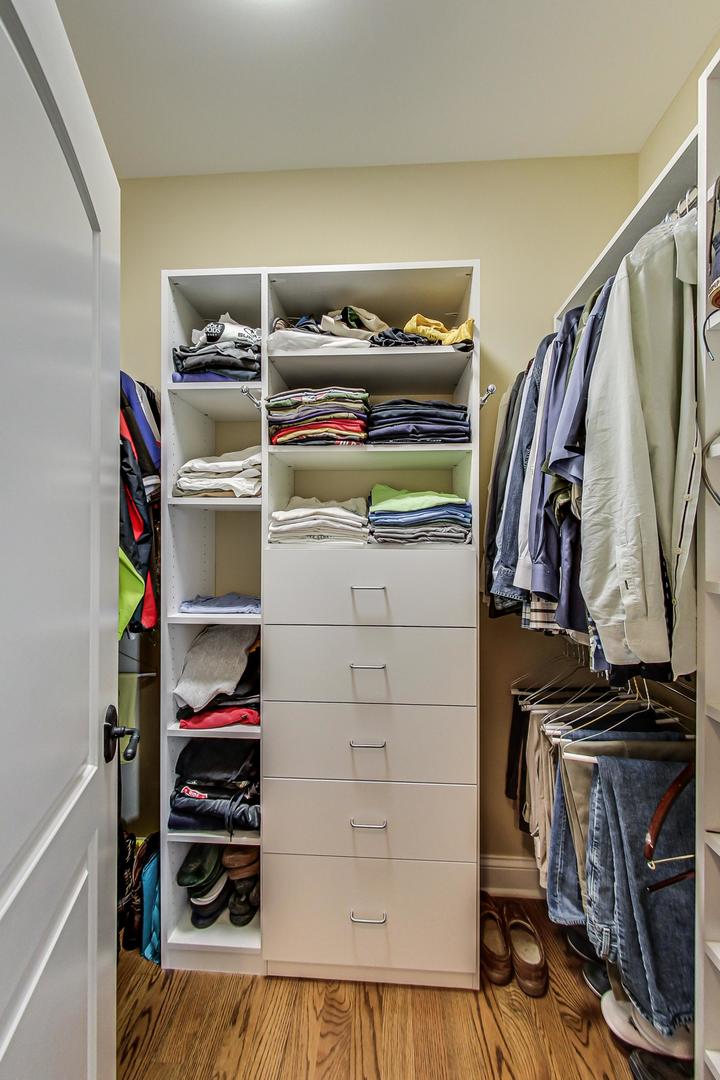 819 Redbud Lane Wilmette, IL 60091 - Photo 35 of 70 a view of walk in closet with clothes and shoes