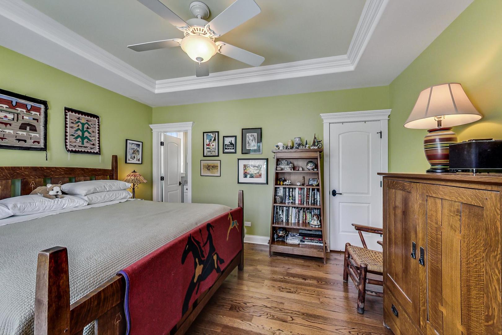 819 Redbud Lane Wilmette, IL 60091 - Photo 38 of 70 a bed room with a bed and a book shelf