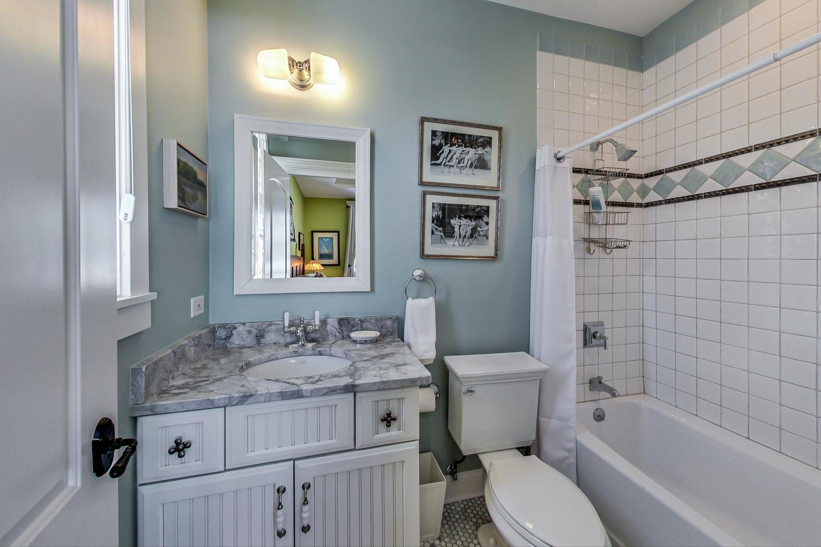 819 Redbud Lane Wilmette, IL 60091 - Photo 40 of 70 a bathroom with a granite countertop sink toilet and shower