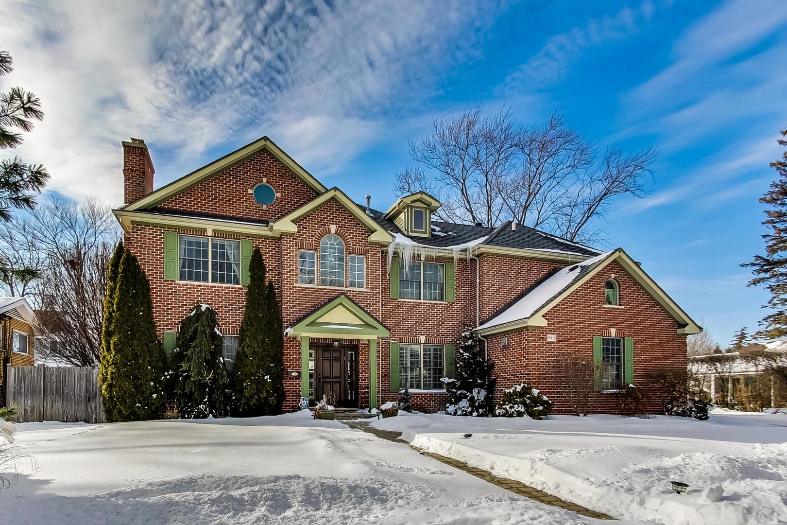 819 Redbud Lane Wilmette, IL 60091 - Photo 4 of 70 a front view of a house with a yard