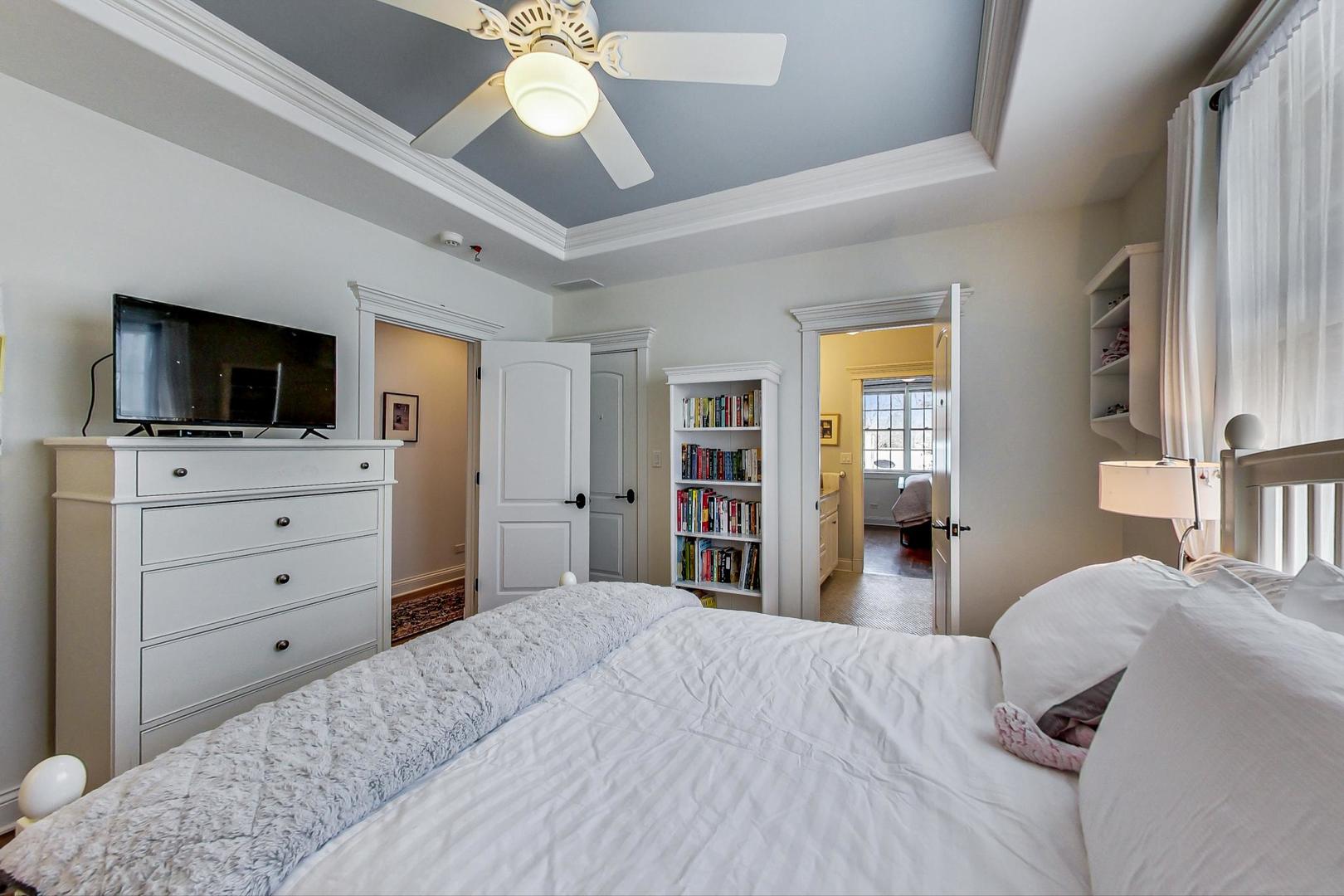 819 Redbud Lane Wilmette, IL 60091 - Photo 44 of 70 a bedroom with a bed and a flat screen tv