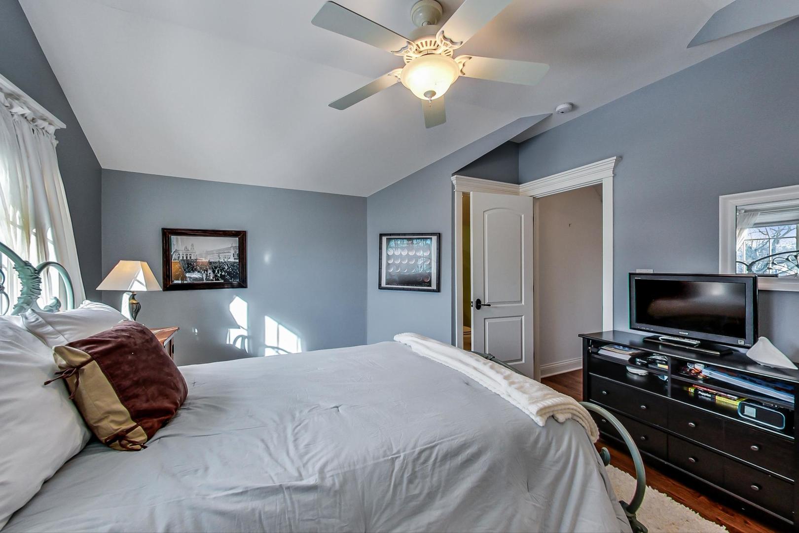 819 Redbud Lane Wilmette, IL 60091 - Photo 54 of 70 a bedroom with a bed and a flat screen tv