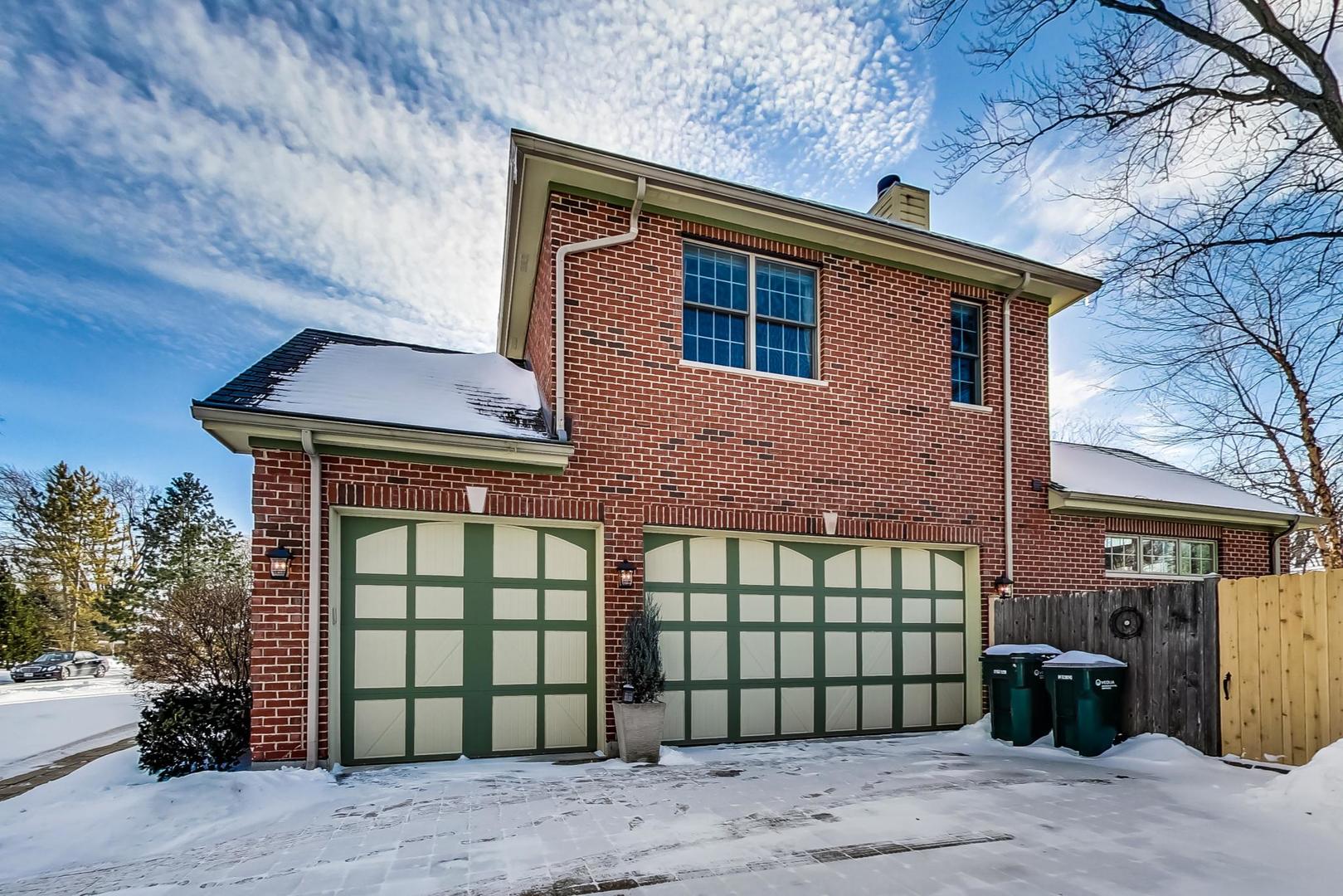 819 Redbud Lane Wilmette, IL 60091 - Photo 66 of 70 a front view of a house with a garden