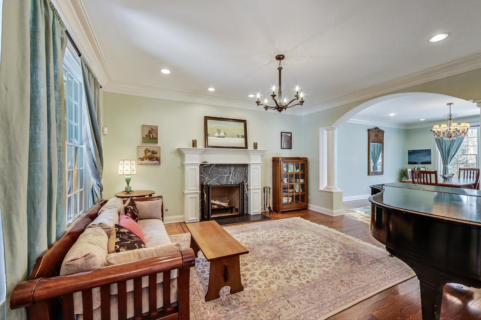 819 Redbud Lane Wilmette, IL 60091 - Photo 7 of 70 a living room with furniture and a fireplace