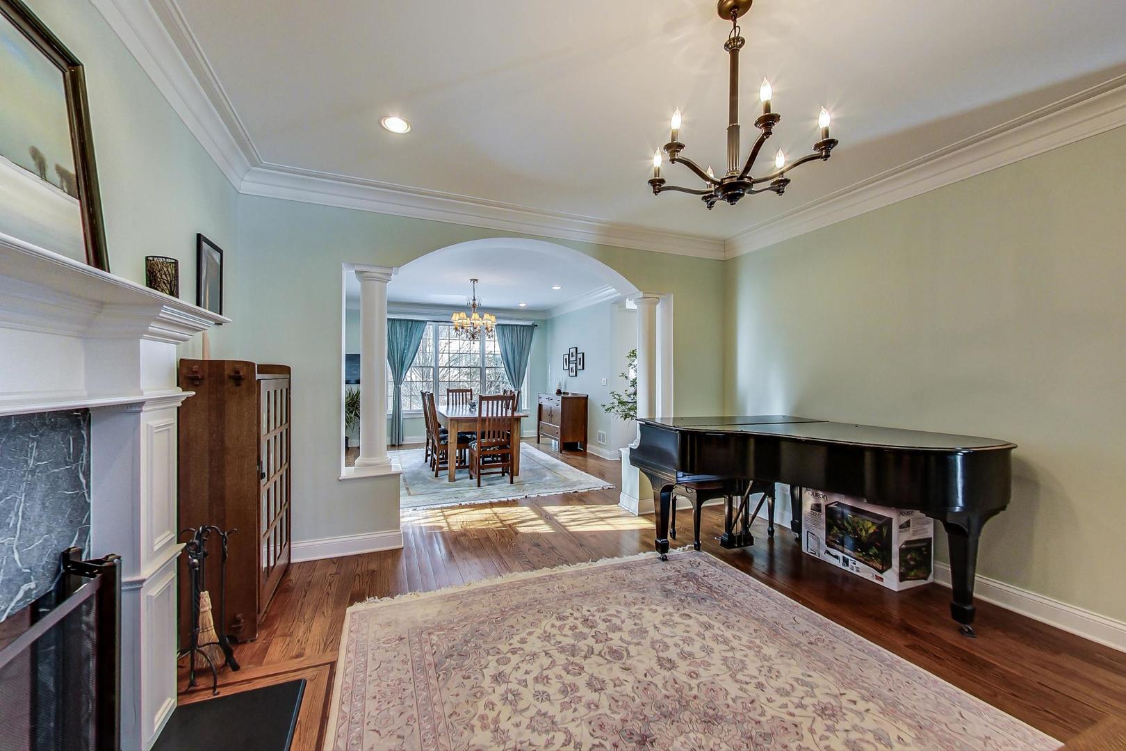 819 Redbud Lane Wilmette, IL 60091 - Photo 8 of 70 a view of a livingroom with furniture a flat screen tv and a fireplace
