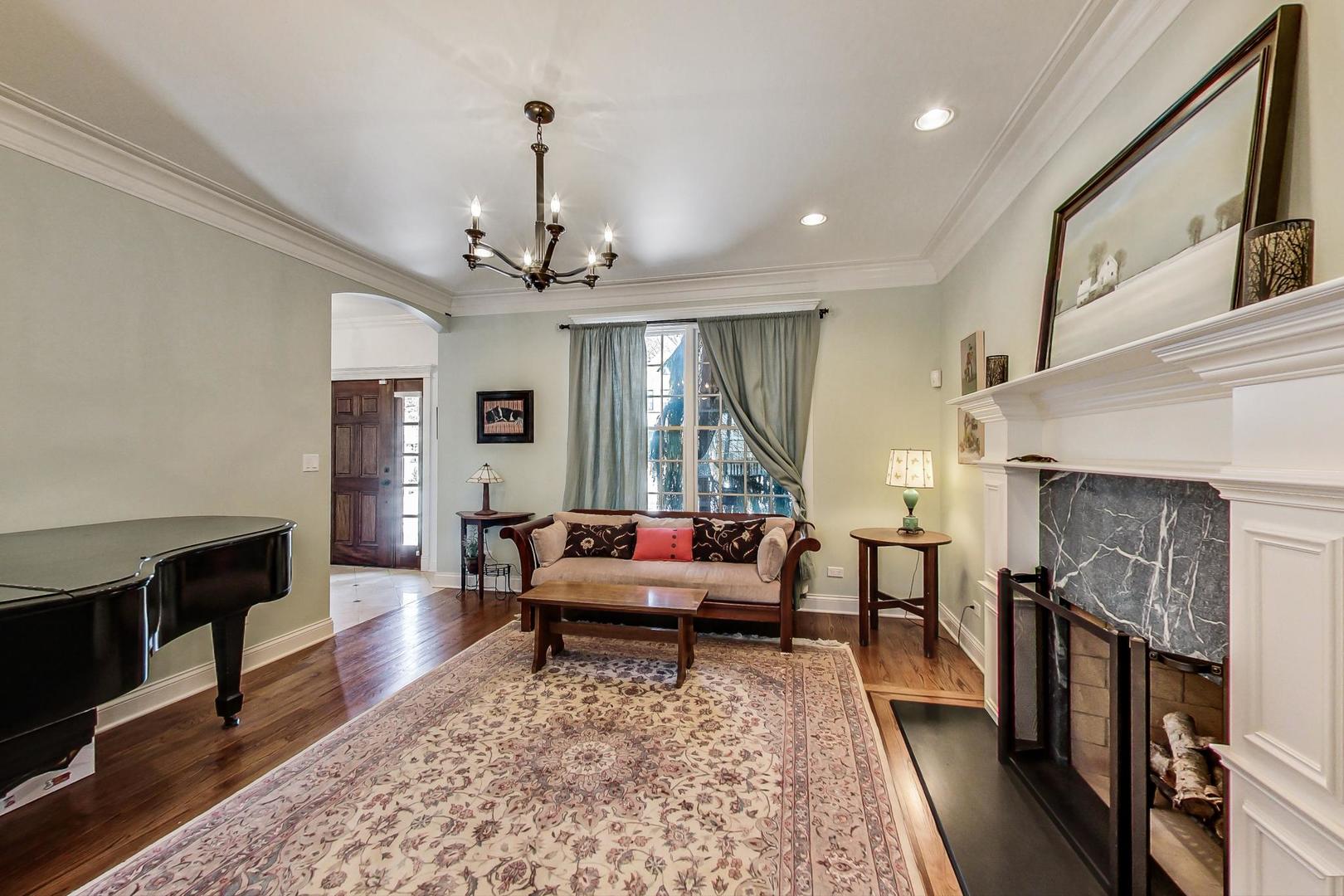 819 Redbud Lane Wilmette, IL 60091 - Photo 9 of 70 a living room with furniture and a fireplace