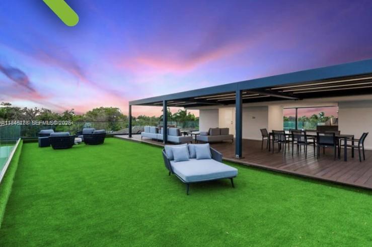 1248 Northeast 89th Street Miami, FL 33138 - Photo 11 of 66 a view of a patio with a table and chairs