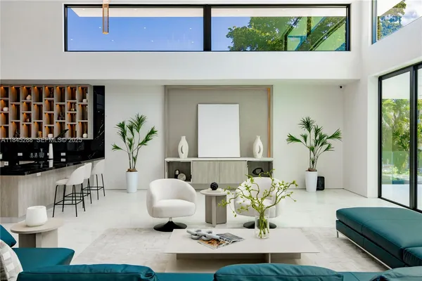 a view of a living room and entryway