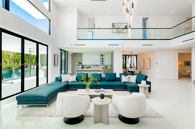 a kitchen with stainless steel appliances granite countertop a sink and a refrigerator