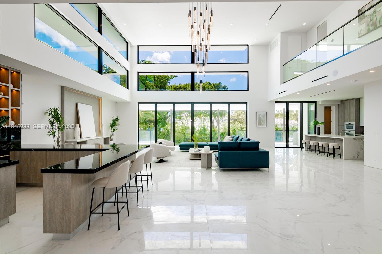 1248 Northeast 89th Street Miami, FL 33138 - Photo 20 of 66 a living room with furniture and floor to ceiling windows