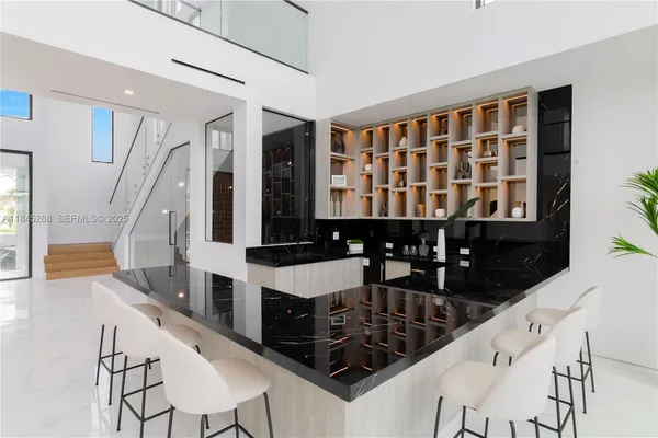 a bathroom with a tub sink shower and mirror
