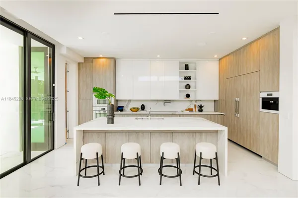 a bathroom with a double vanity sink toilet and shower