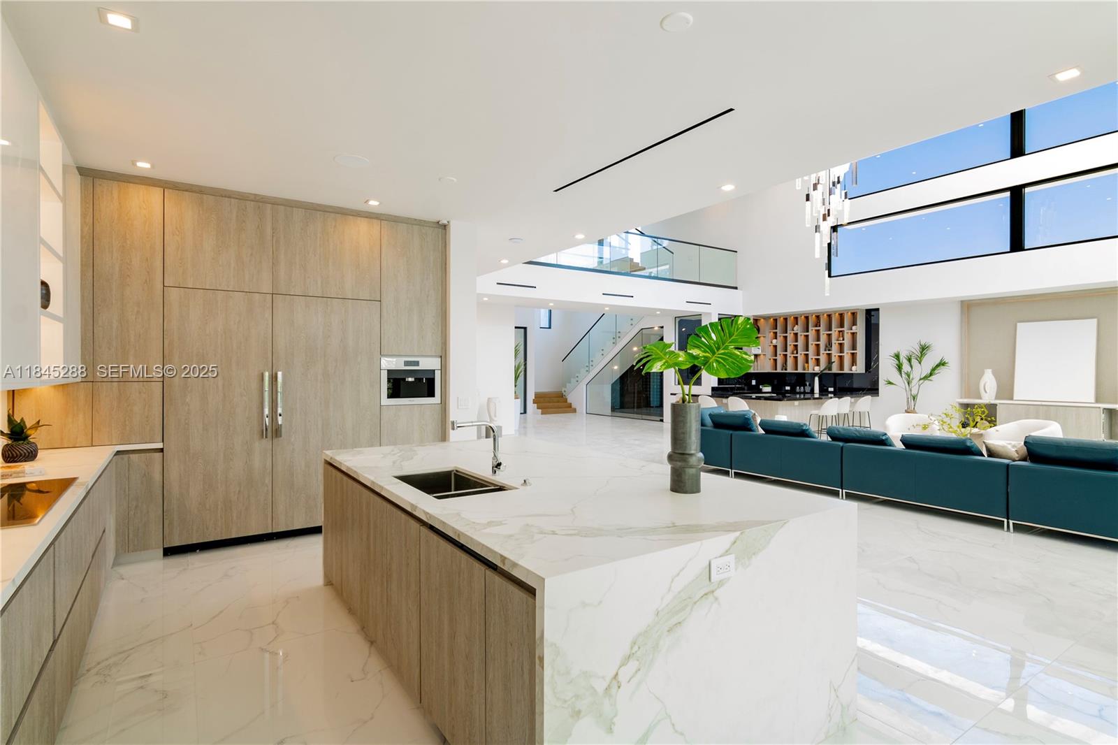 1248 Northeast 89th Street Miami, FL 33138 - Photo 24 of 66 a kitchen with stainless steel appliances kitchen island granite countertop a sink and cabinets