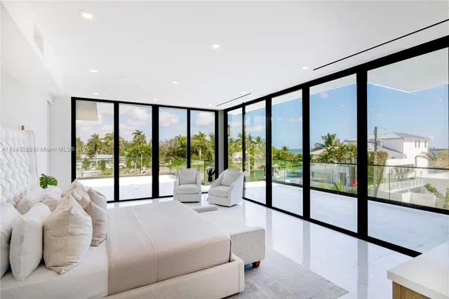a lobby with furniture and floor to ceiling window