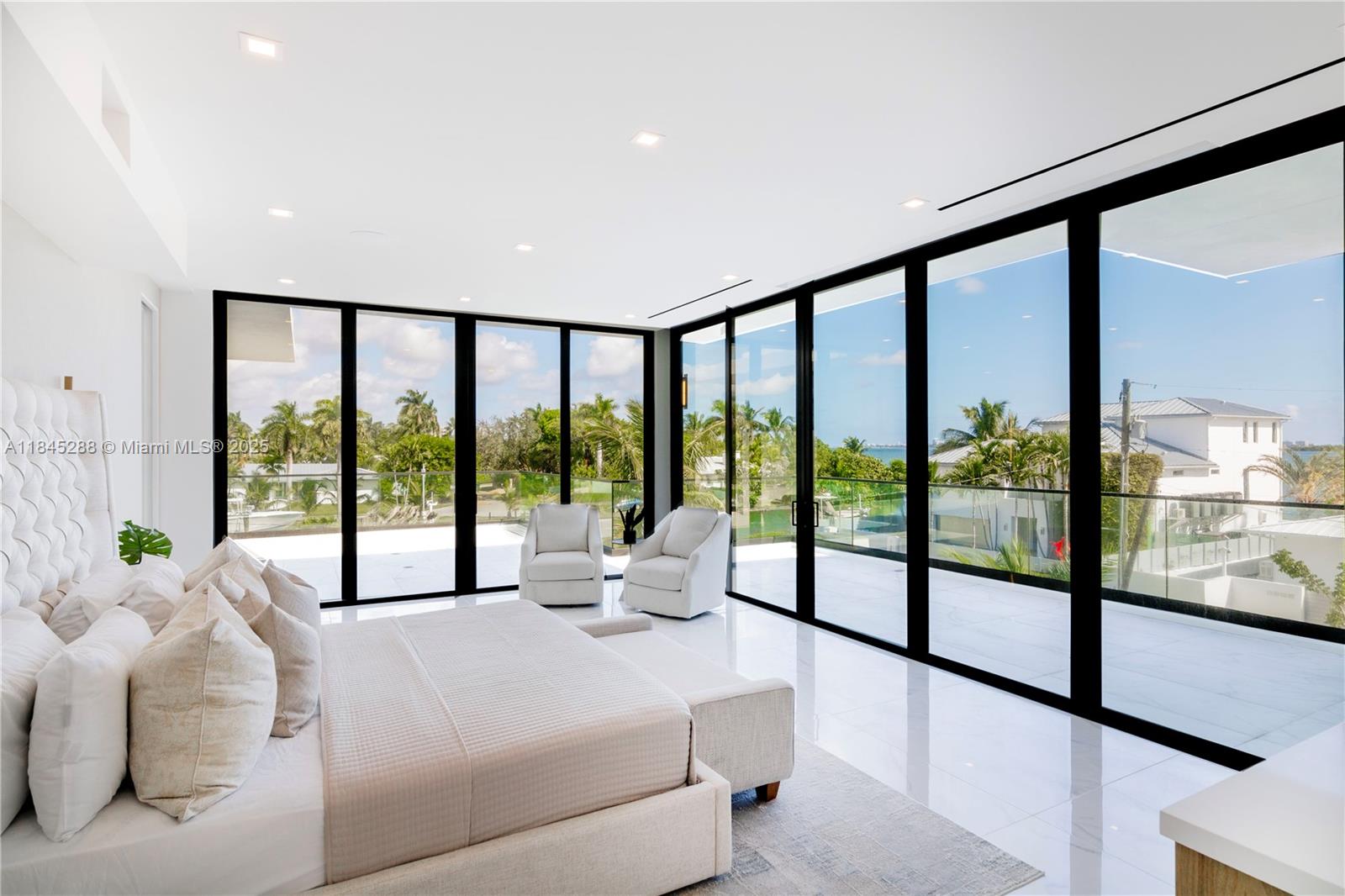 1248 Northeast 89th Street Miami, FL 33138 - Photo 25 of 66 a spacious bedroom with a large bed and a large window