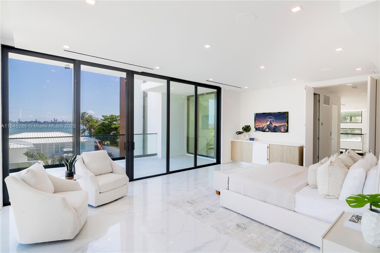 1248 Northeast 89th Street Miami, FL 33138 - Photo 26 of 66 a living room with furniture and large windows