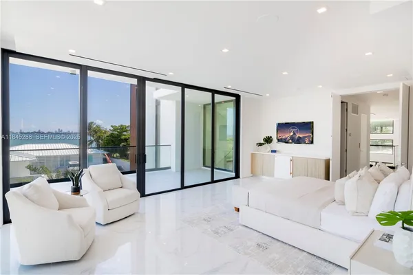 a view of a patio with a table and chairs