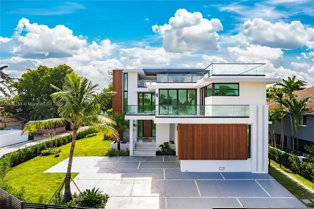 a view of a patio with couches chairs and a yard