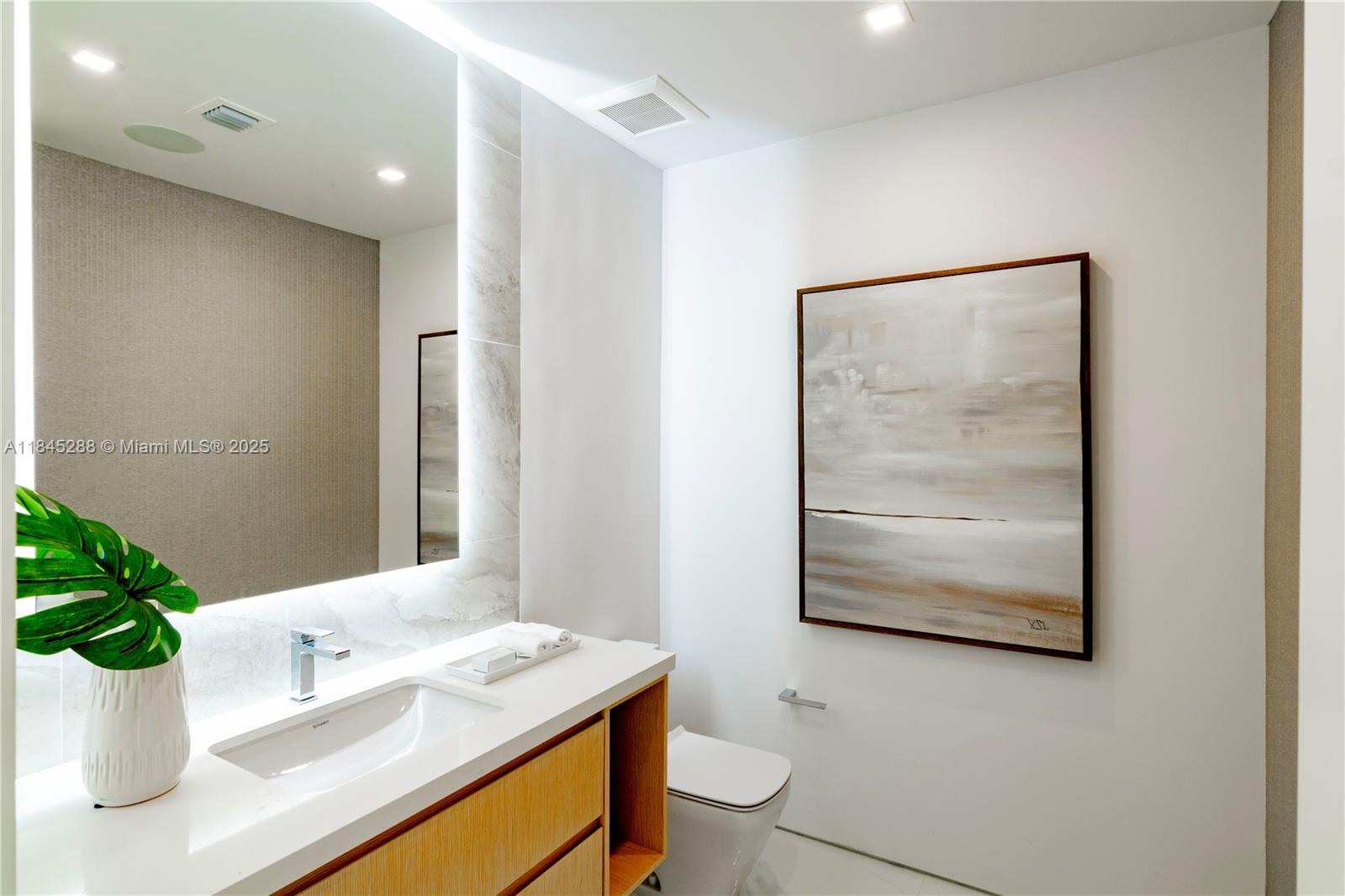 1248 Northeast 89th Street Miami, FL 33138 - Photo 32 of 66 a bathroom with a sink a toilet and mirror