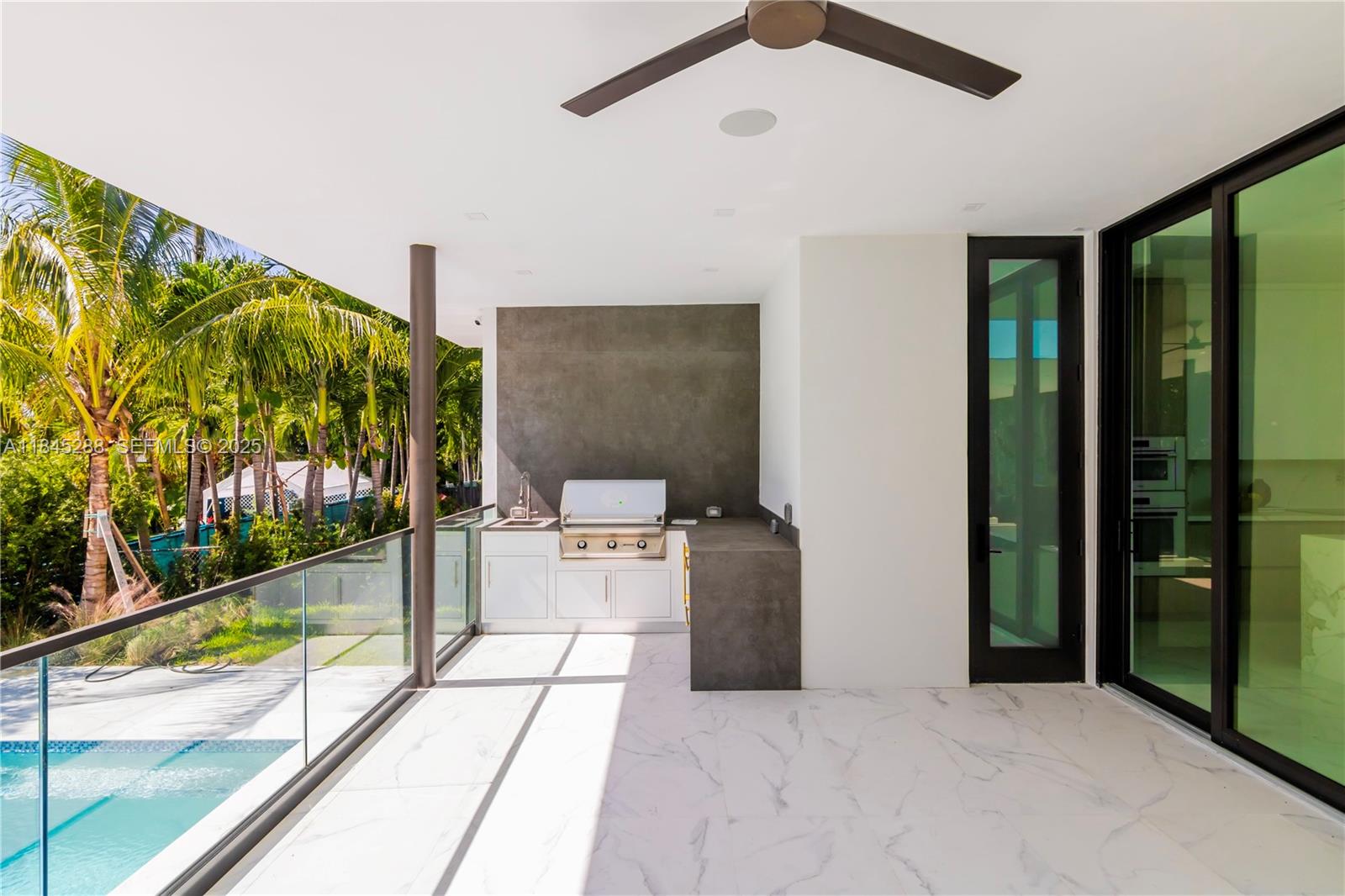 1248 Northeast 89th Street Miami, FL 33138 - Photo 34 of 66 a view of a patio with a table and chairs