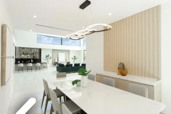 a kitchen with stainless steel appliances a stove and white cabinets